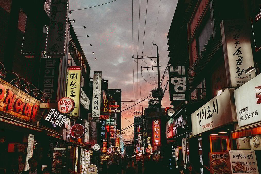 A Korean street with the sunset in the background